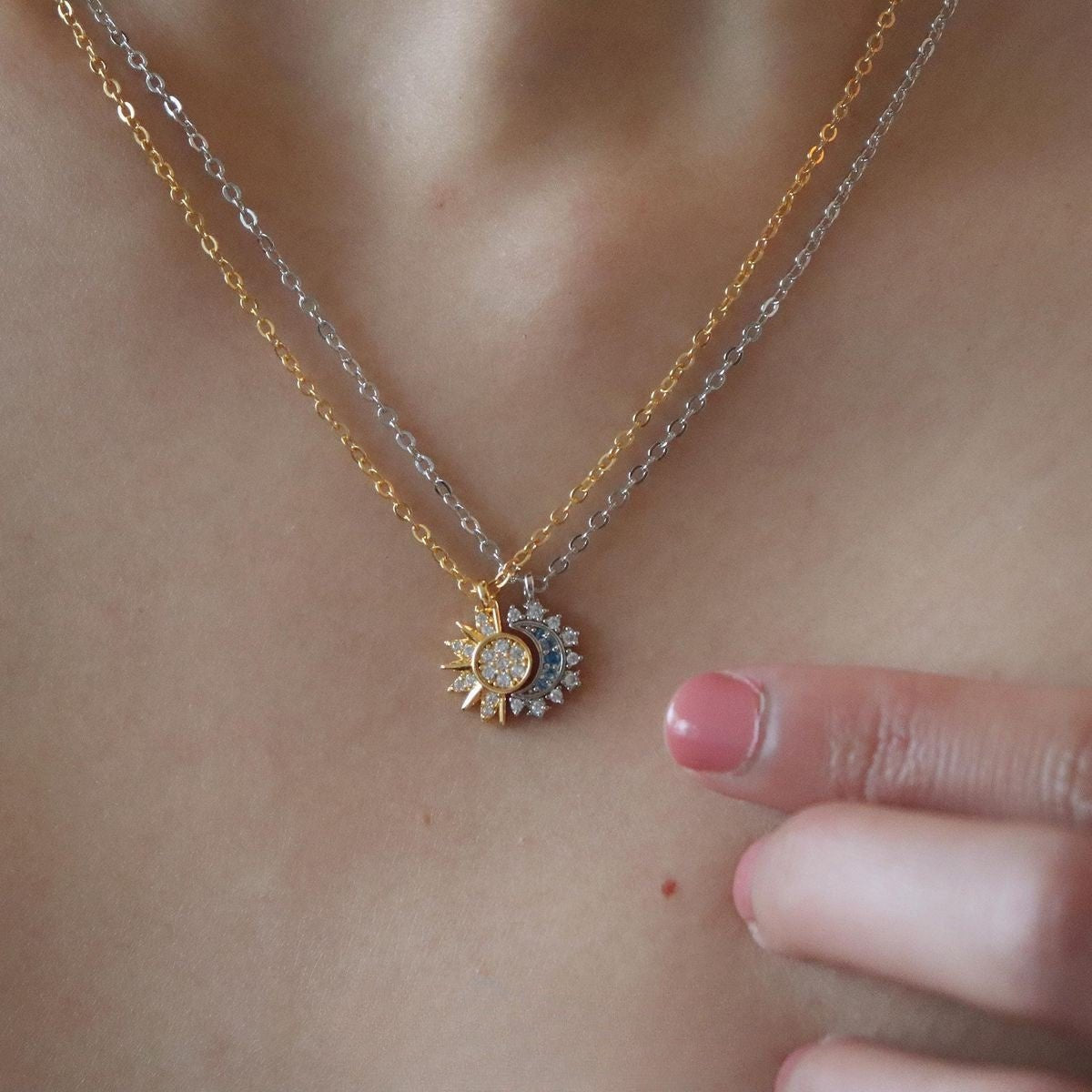 Necklace with a sun-shaped pendant on a person's neck