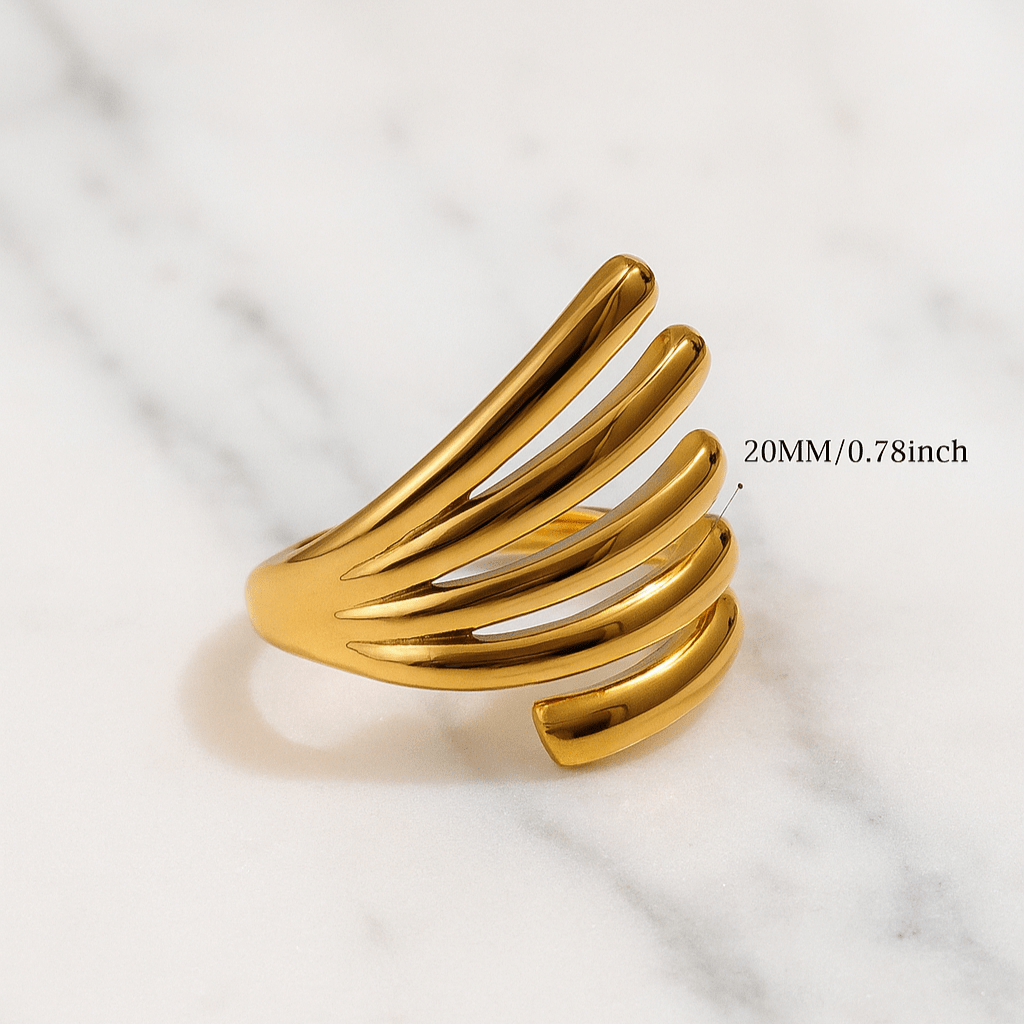 Gold ring on a marble surface with text indicating size.