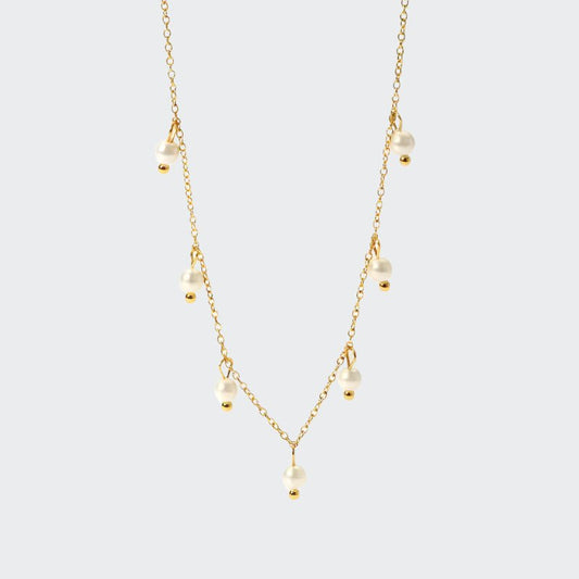 A delicate gold chain necklace adorned with luminous freshwater pearls.