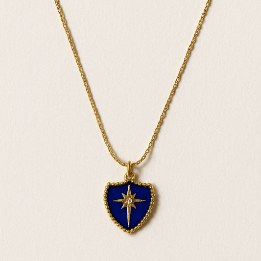 Necklace with a blue shield-shaped pendant on a light beige background