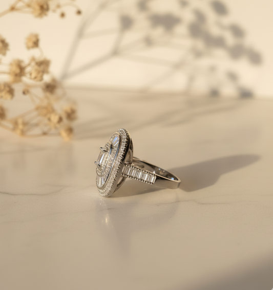 Silver ring with gemstones on a light background