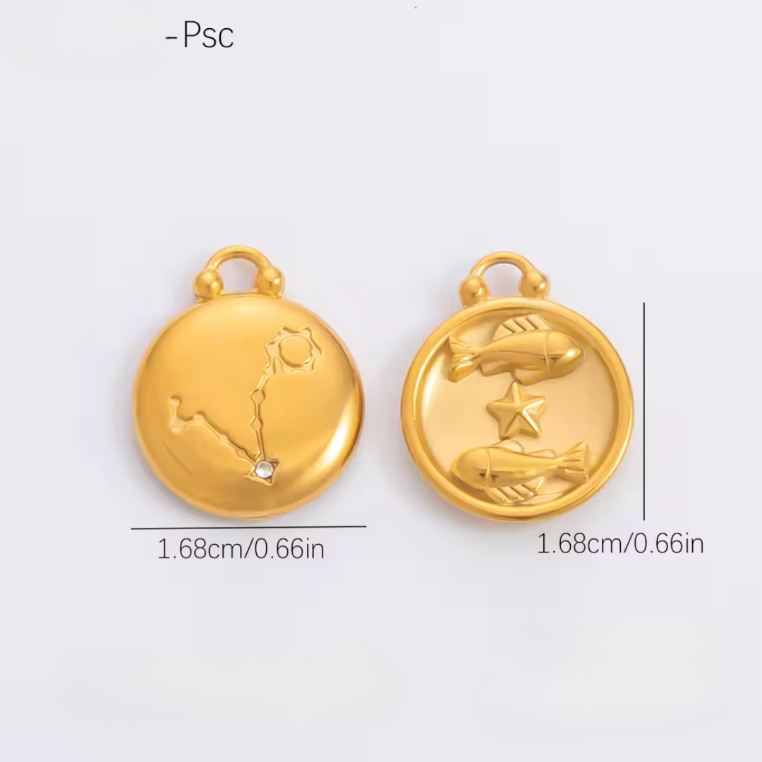 Two gold pendants with zodiac designs on a light gray background