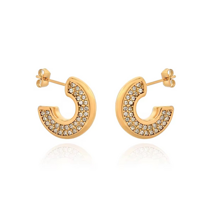 Gold hoop earrings with embedded stones on a white background
