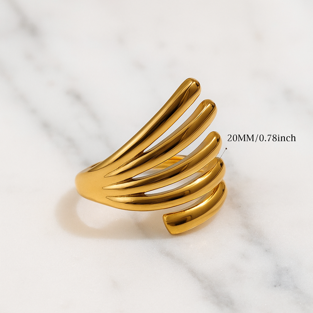 Gold ring on a marble surface with text indicating size.