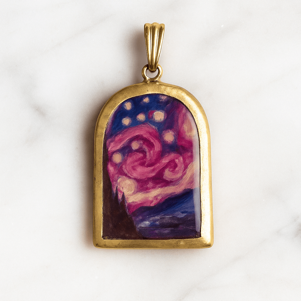 Gold pendant with a colorful abstract design on a white marble background