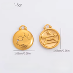 Two gold pendants with zodiac symbols on a light gray background