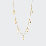 A delicate gold chain necklace adorned with luminous freshwater pearls.