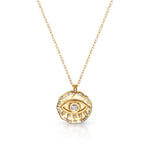 Gold necklace with an eye-shaped pendant on a white background