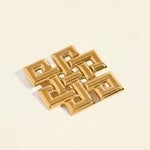 Gold geometric pendant with measurements on a white background