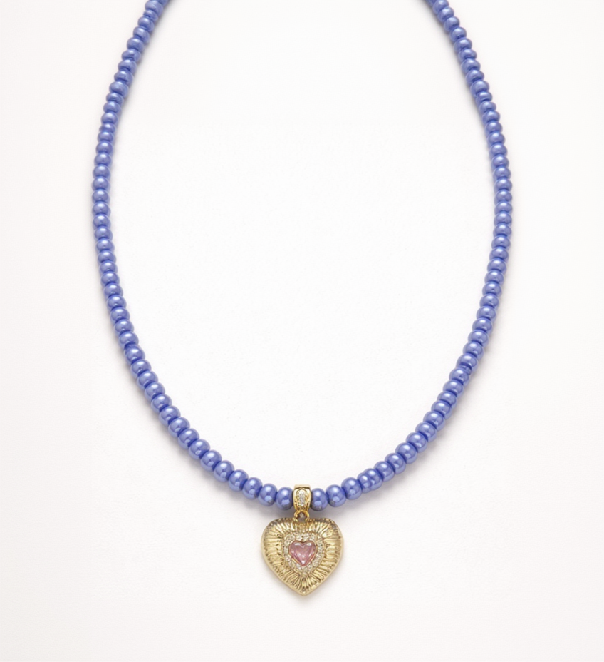Necklace with blue beads and a heart-shaped pendant on a white background
