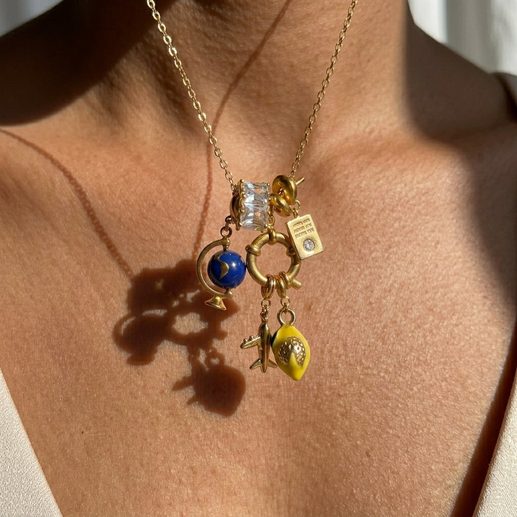Necklace with various charms on a person's neck