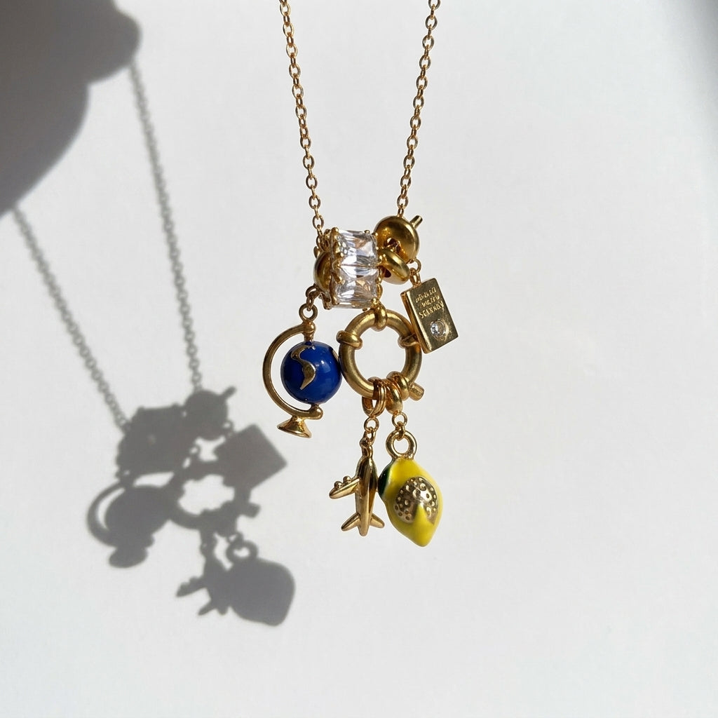 Necklace with various charms on a white background