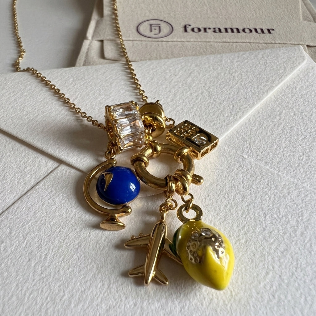 Necklace with various charms on a white background, featuring the brand 'foramour'.