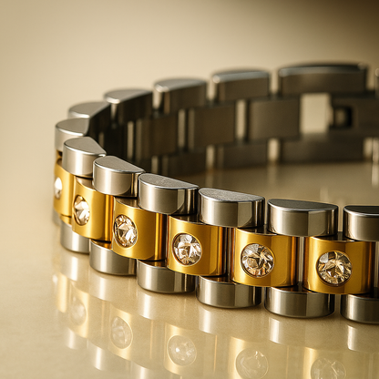 Gold and silver bracelet with diamond accents on a reflective surface