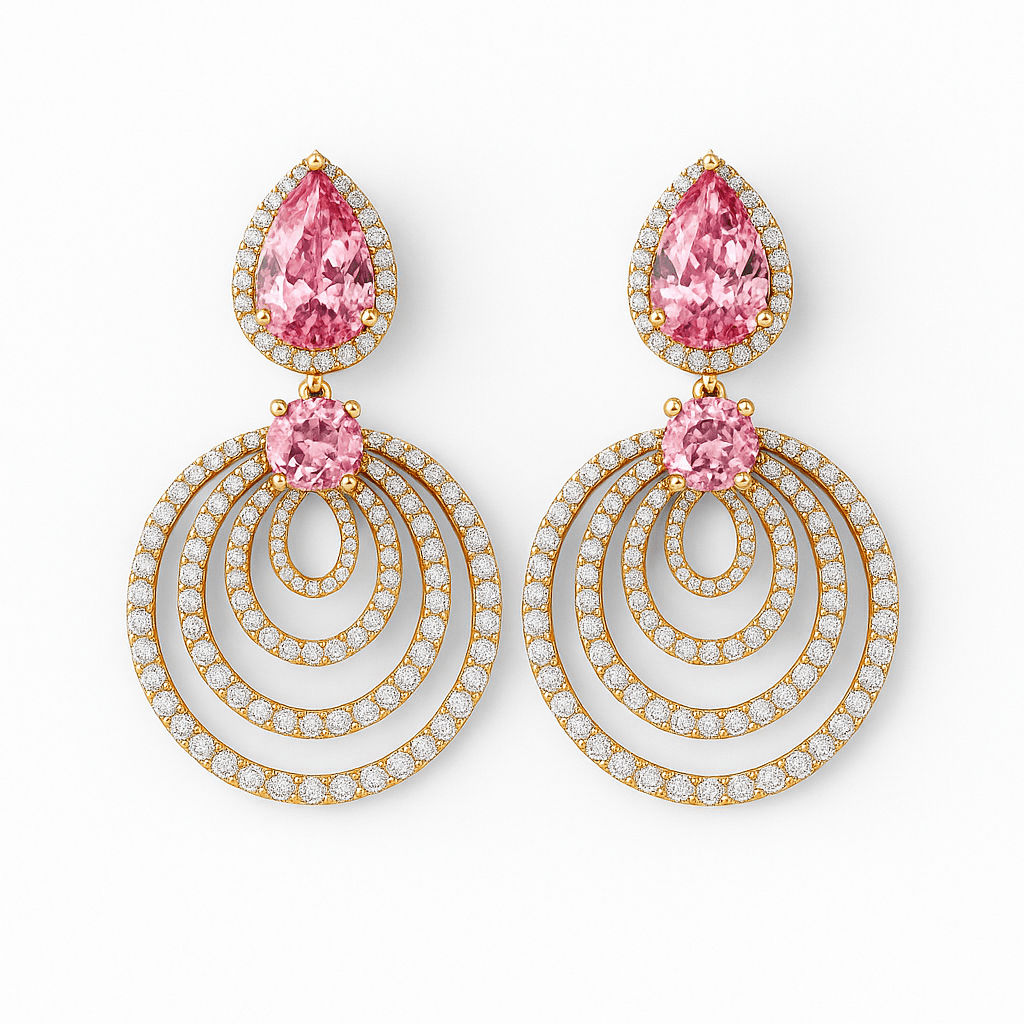 Pair of earrings with pink gemstones and gold and diamond accents on a white background