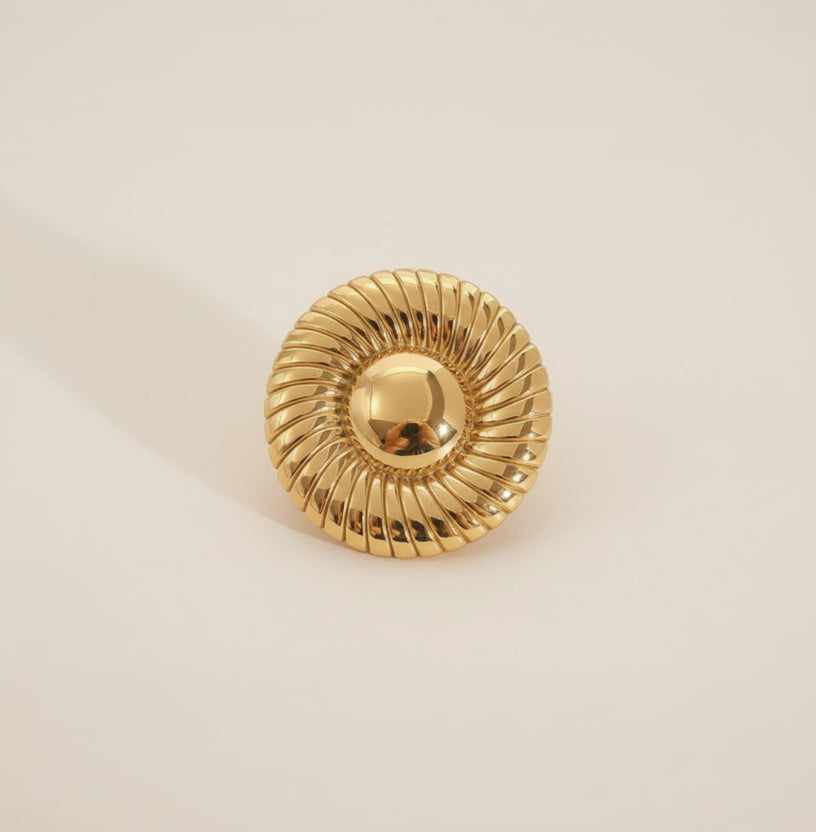 Gold decorative element on a textured stone surface