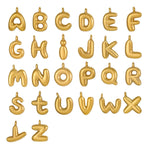 Gold letter balloons spelling out the alphabet on a white background