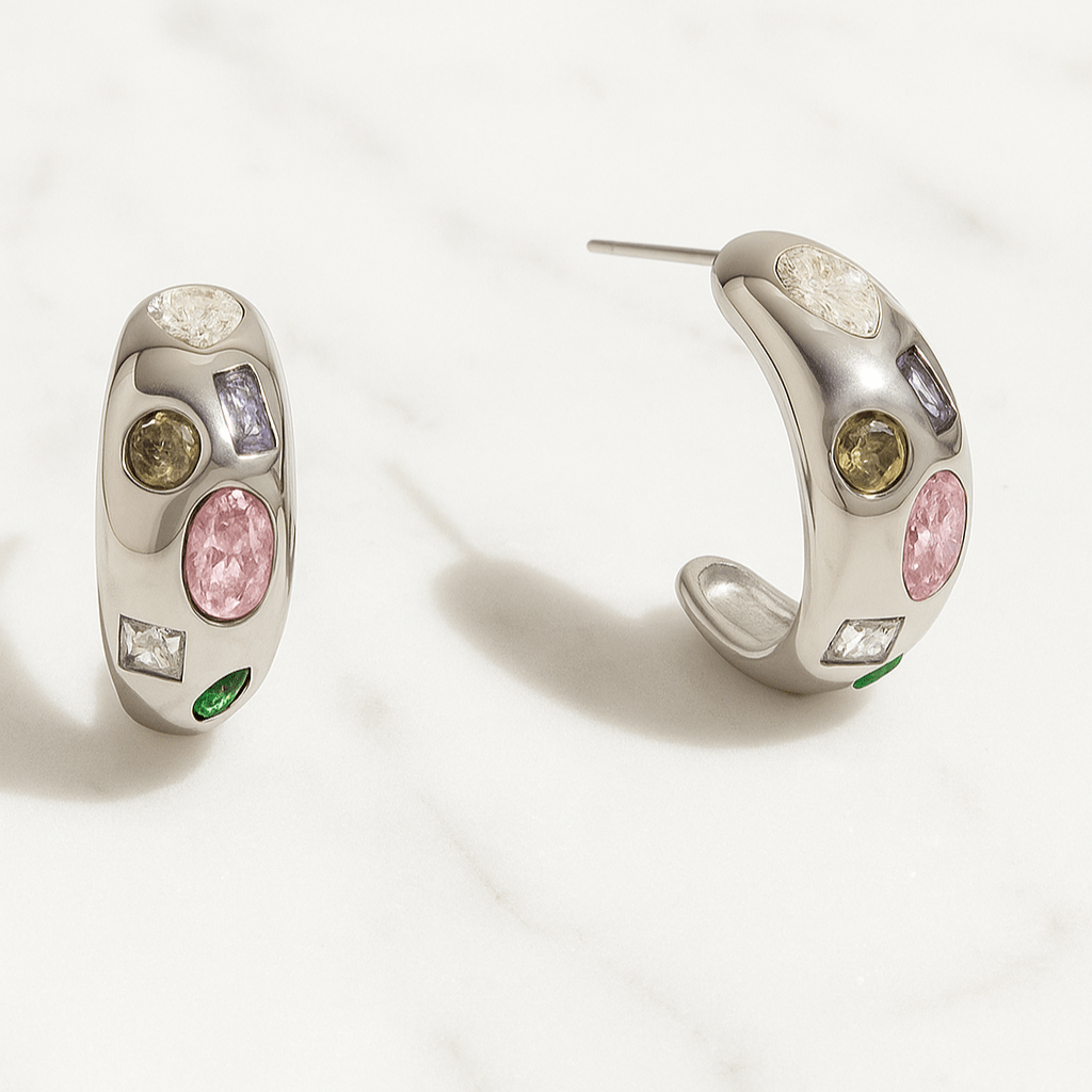 Pair of earrings with colorful gemstones on a white background