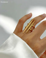 Gold ring on a hand with a blurred background