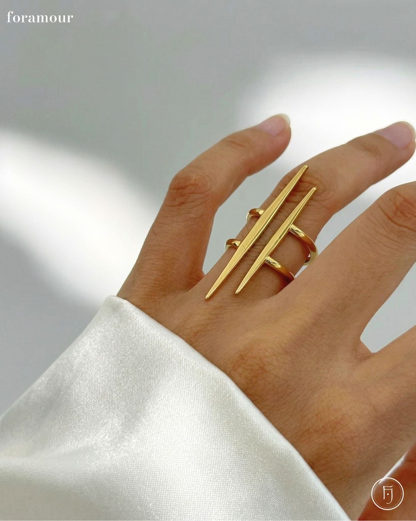 Gold ring on a hand with a blurred background