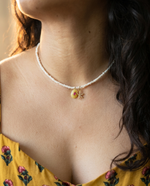 Pearl necklace with charms
