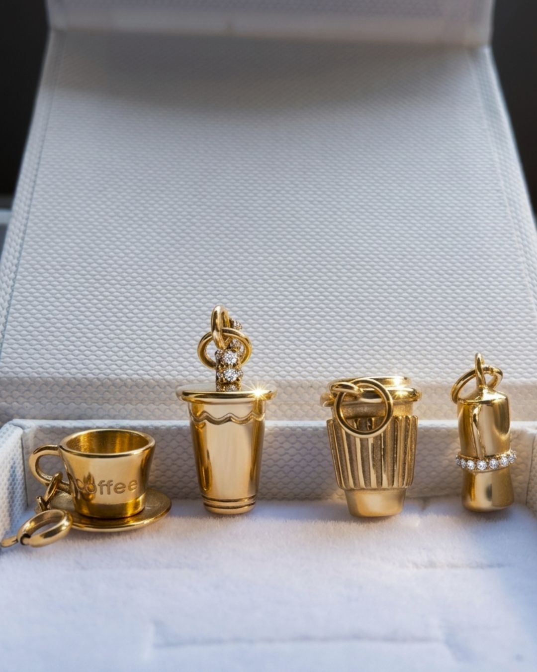 Set of gold-colored jewelry pieces on a textured surface