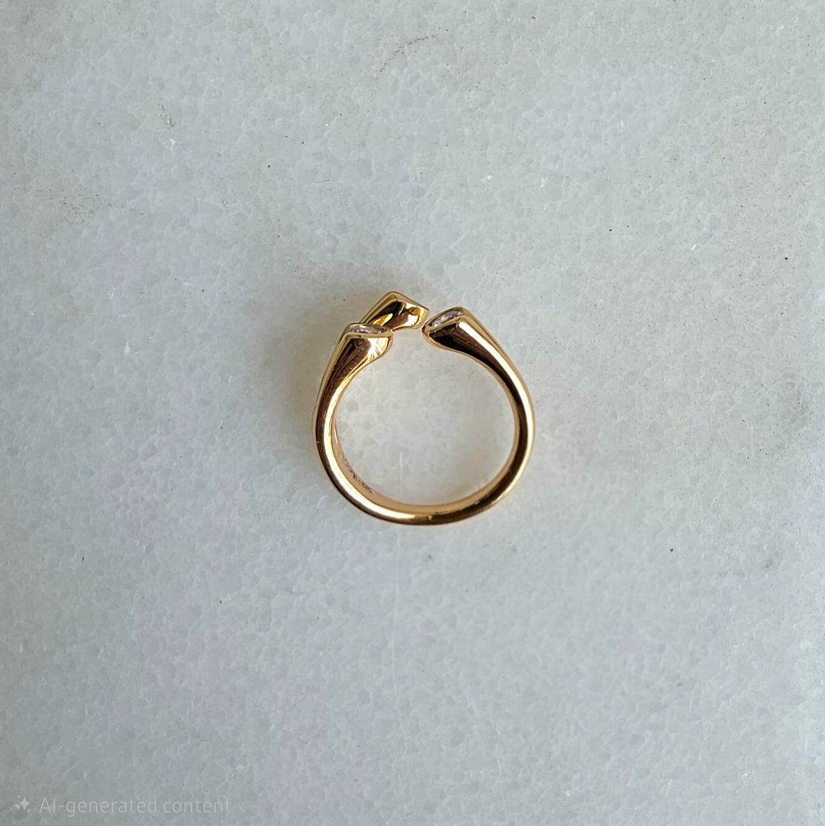Gold hoop earring on a light gray background