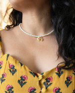 Pearl necklace with charms