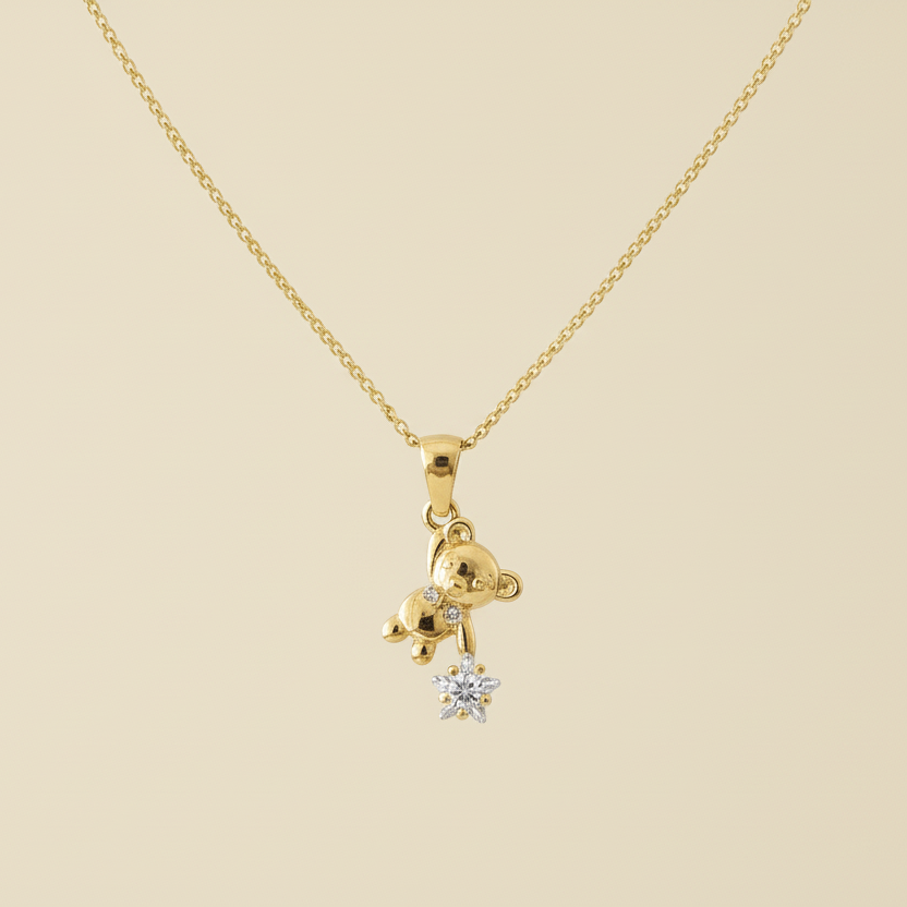 Gold necklace with a small pendant on a white background