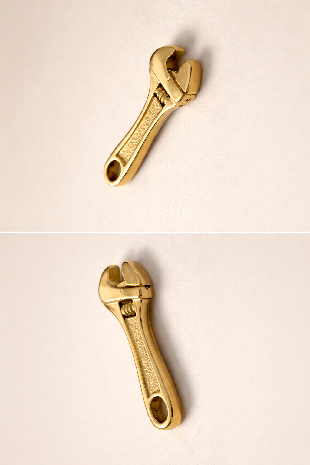 Gold wrench-shaped keychain on a beige background
