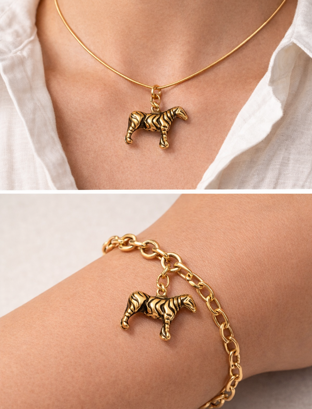 Gold zebra pendant necklace and bracelet on a person wearing a white shirt.